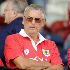 Unwavering Support: A Bristol City Fan Amidst the Rivalry at Rochdale's Stadium (August 2014) Unwavering Support: A Bristol City Fan Amidst the Rivalry at Rochdale's Stadium (August 2014)