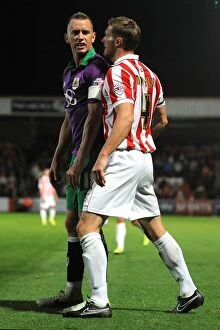 Images Dated 8th October 2014: Aaron Wilbraham and Matt Taylor Clash in Intense Rivalry: Cheltenham Town vs