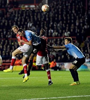 Images Dated 21st October 2014: Aaron Wilbraham's Leap Over Bradford: A Pivotal Moment in Bristol City's Sky Bet League One Clash