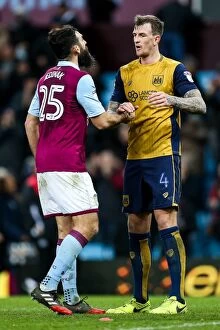 Images Dated 28th February 2017: Aden Flint of Bristol City Consoles Mile Jedinak of Aston Villa after 2-0 Defeat at Villa Park