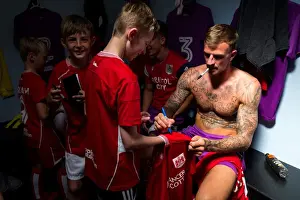Bristol Manor Farm V Bristol City Prints: Aden Flint Signing Autographs in Bristol City Dressing Room, 2017