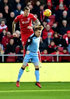 Bristol City V Rotherham United Prints: Aden Flint vs. Danny Ward: Epic Aerial Battle at Ashton Gate