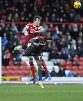 Bristol City V Carlisle United Prints: Aden Flint vs. David Amoo: Intense Aerial Battle at Ashton Gate - Bristol City vs