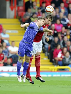 Bristol City V Wolves Prints: Aden Flint vs. Kevin Doyle: A Lofted Duel at Ashton Gate