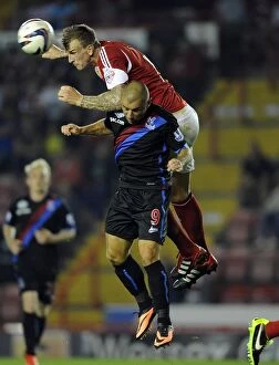 Images Dated 27th August 2013: Aden Flint vs. Kevin Phillips: Battle for the High Ball - Bristol City vs. Crystal Palace, 2013