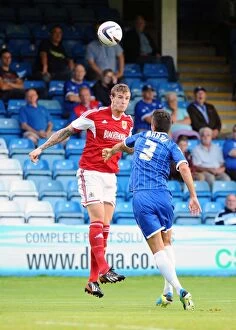 Images Dated 6th August 2013: Aden Flint Wins a Header: Gillingham vs. Bristol City, Capital One Cup First Round