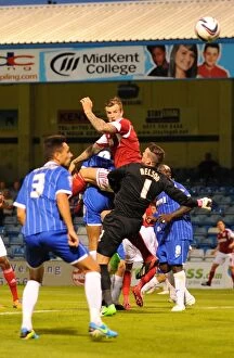 Images Dated 6th August 2013: Aden Flint's Close Call: Bristol City's Defender Leaps High but Heads Wide vs. Gillingham