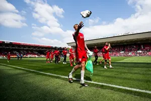Bristol City V Birmingham City Prints: Aden Flint's Euphoric Moment: Throwing Boots into the Crowd (Bristol City vs)