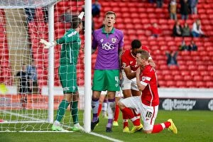 Images Dated 25th October 2014: Aden Flint's Frustration: A Missed Headed Chance for Bristol City against Barnsley, October 2014