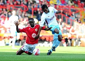 Bristol City v Burnley Collection: Adomah vs Bartley: Battle for Supremacy in the Championship Clash between Bristol City