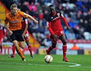 Bristol City V Wolves Prints: Adomah vs. Berra: Intense Battle for Possession in Bristol City vs
