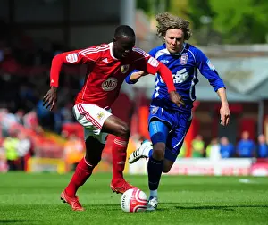 Adomah vs Bullard: Intense Battle for the Ball in the Championship Clash between Bristol City and Ipswich Town (16-04-2011)