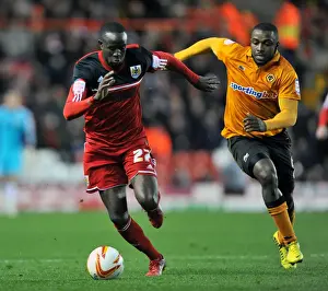 Adomah vs Ebanks-Blake: Intense Battle for Possession in Bristol City vs Wolves Championship Clash