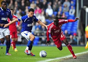 Images Dated 3rd March 2012: Adomah vs Edwards: Intense Battle for Ball Possession during Ipswich Town vs Bristol City Football