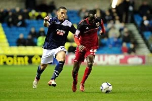 Images Dated 1st January 2013: Adomah vs. Feeney: Intense Rivalry on The Den's Football Field - Championship: Millwall vs