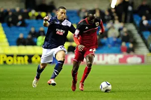 2012 Prints: Adomah vs. Feeney: Intense Rivalry on The Den's Football Field - Championship: Millwall vs
