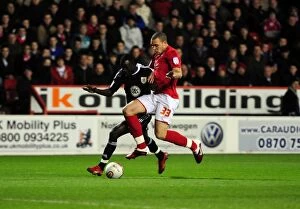 Images Dated 25th January 2011: Adomah vs. Lynch: Intense Battle for Ball Possession during Forest vs