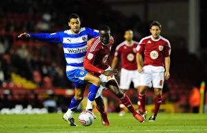 Images Dated 19th October 2010: Adomah vs McAnuff: Intense Moment from the Npower Championship Clash between Bristol City