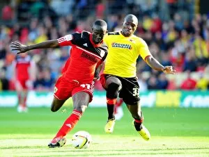 Images Dated 22nd September 2012: Adomah vs. Nosworthy: Intense Battle for Control in Watford vs. Bristol City Championship Clash