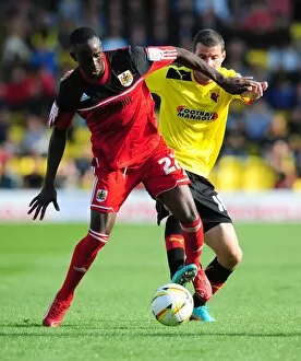 Images Dated 22nd September 2012: Adomah vs Pudil: Intense Battle for Ball Possession in Watford vs Bristol City Championship Clash