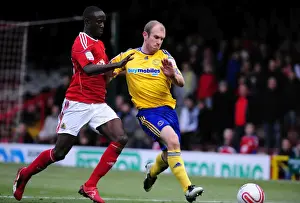 Bristol City V Derby County Prints: Adomah vs Roberts: Battle for the Ball in Bristol City vs Derby County Championship Clash