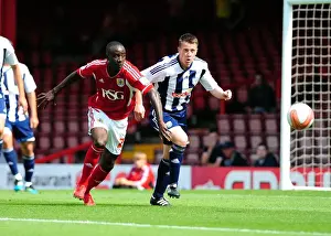 Season 11-12 Prints: Adomah vs. Shorey: Intense Battle for Possession in Bristol City vs