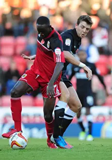 Bristol City V Charlton Prints: Adomah vs Stephens: Intense Battle for Possession in Bristol City vs Charlton Athletic Championship Clash
