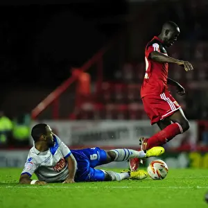 Bristol City V Millwall Prints: Adomah vs Trotter: Intense Battle in Bristol City vs Millwall Football Match
