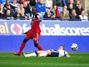 Bolton Wanderers v Bristol City Collection: Adomah vs Warnock: Intense Battle in the 2012 Championship Clash between Bolton Wanderers