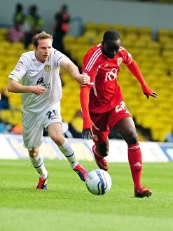 Leeds United v Bristol City Collection: Adomah vs. White: Battle for the Ball in Leeds United vs. Bristol City League Cup Clash - 16/09/2011