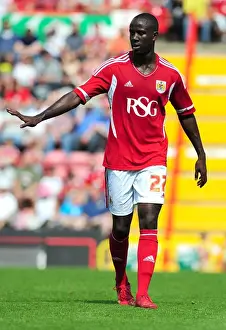 Season 11-12 Prints: Adomah's Thrilling Performance: Championship Showdown - Bristol City vs