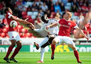 Images Dated 1st September 2012: Adomah's Tight Squeeze: Barnsley vs. Bristol City, Championship Showdown, September 1, 2012