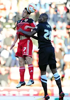 Bristol City V Charlton Prints: Aerial Clash: Sam Baldock vs Leon Cort - Championship Showdown at Ashton Gate