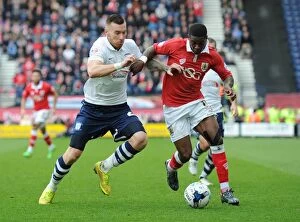 Images Dated 11th April 2015: Agard vs. King: Intense Battle in Preston North End vs. Bristol City Football Match, April 2015