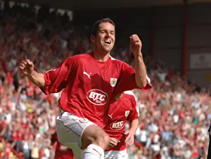 Promotion Prints: Alex Russell's Euphoric Moment: Celebrating Promotion with Bristol City to Championship