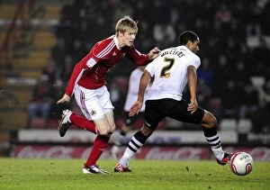 Images Dated 1st February 2011: Andy Keogh Darts Past Ashley Williams: A Pivotal Moment in the 2011 Championship Clash Between