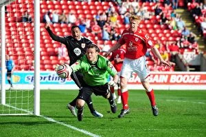 Images Dated 9th April 2011: Barnsley Goalkeeper Luke Steele Struggles to Keep Ball in Championship Clash vs