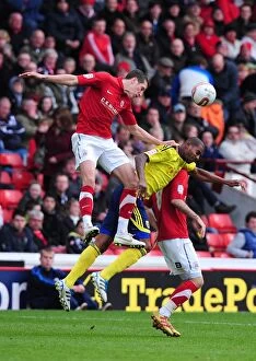 Images Dated 29th October 2011: Barnsley vs. Bristol City: Intense Battle for the High Ball in Championship Match, October 2011