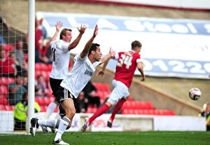 Images Dated 1st September 2012: Barnsley's John Stones Controversially Halts Martyn Woolford's Goalbound Effort - Bristol City vs