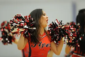 Basketball Cheerleader Thrills Crowd during Break at Bristol Flyers Game