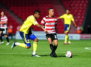 Framed Print : Battle for the Ball: Jordan Spence vs. Kyle Bennett - League Cup Clash, Doncaster Rovers vs. Bristol City (27 / 08 / 2011)