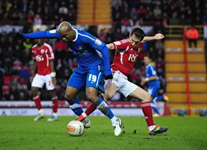 Bristol City V Doncaster Rovers Prints: A Battle for the Ball: Neil Kilkenny vs El-Hadji Diouf - Championship Showdown at Ashton Gate (21/01/2012)