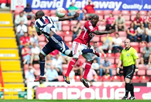 Season 11-12 Prints: Battleground Ashton Gate: Campbell-Ryce vs. Mulumbu - Championship Showdown, 2011