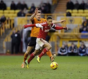 Images Dated 25th January 2014: Battleground Molineux: McDonald vs. Reid - A Football Rivalry Unfolds (Wolves vs. Bristol City)