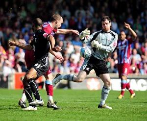 Images Dated 17th April 2010: Battling for the Ball: Haynes vs. Mirfin and Murphy in the Intense Championship Clash between