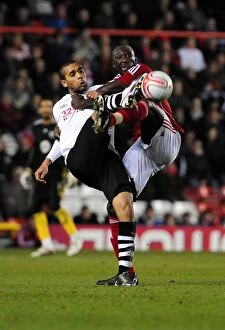 Images Dated 1st February 2011: Battling for Championship Supremacy: Stewart vs Moore - A Football Rivalry at Ashton Gate