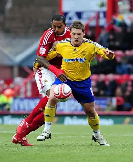 Bristol City V Derby County Prints: Battling for Championship Supremacy: Marvin Elliott vs. Kris Commons (11-12-2010)