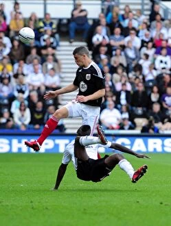 Images Dated 30th April 2011: Battling for Championship Supremacy: Wilson vs. Robinson, Derby County vs. Bristol City, April 2011