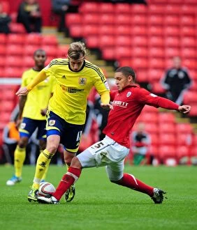 Images Dated 29th October 2011: Battling for Championship Supremacy: Woolford vs. Doyle at Oakwell Stadium