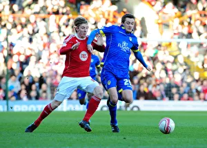 Battling for Control: Woolford vs McCartney in the Intense Championship Showdown between Bristol City and Leeds United at Ashton Gate Stadium (February 12, 2011)